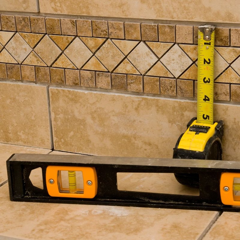 tape measure and spirit level against wall from Perge Carpet & Floors in Wheaton, MD | From facts to fashion, we make beautiful floors easy! Perge Carpet & Floors in Wheaton | Perge Carpet & Floors | Wheaton | 301-942-3330