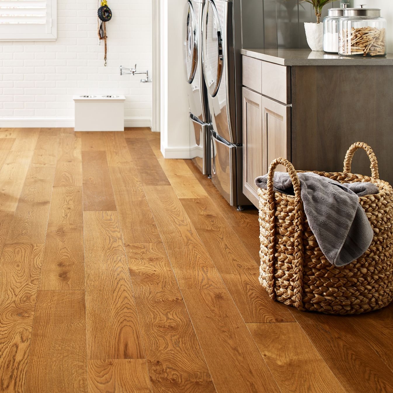 Laundry room with wood-look luxury vinyl flooring from Perge Carpet & Floors in Wheaton, MD